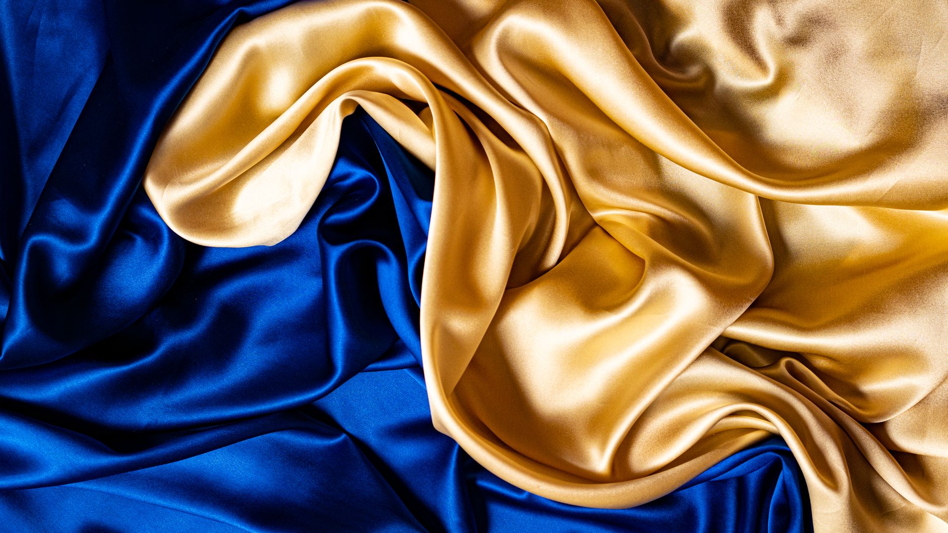 Flowing blue and gold silk fabric.